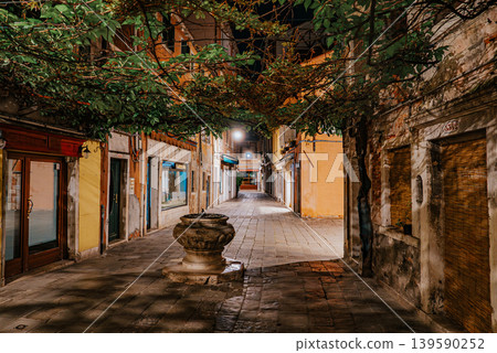 Empty Venice street at night with soft lights and historic architecture Empty Venice street at night with soft lights and historic architecture 139590252