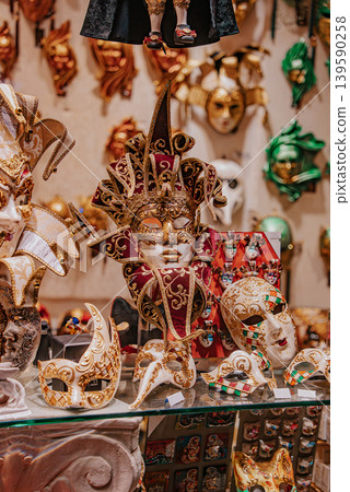 Elegant Venetian carnival masks showcased in boutique window in Venice Italy Elegant Venetian carnival masks showcased in boutique window in Venice Italy 139590258