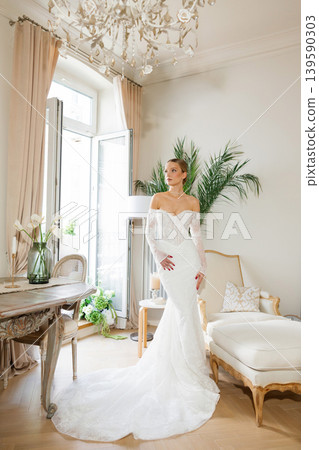 Bride wearing elegant wedding dress in luxury interior Bride wearing elegant wedding dress in luxury interior 139590303