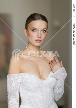 Young woman posing in beautiful white bridal dress Young woman posing in beautiful white bridal dress 139590304