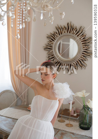 Bride wearing wedding dress posing in elegant interior Bride wearing wedding dress posing in elegant interior 139590318