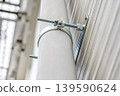 New exterior wall and downspout fasteners viewed from below - Renovation 139590624