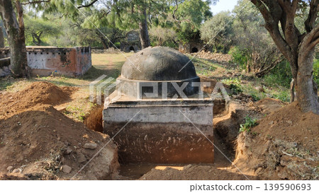 Tilla Jogian dark domed samadhi surrounded by excavation pits Pakistan Tilla Jogian dark domed samadhi surrounded by excavation pits Pakistan 139590693