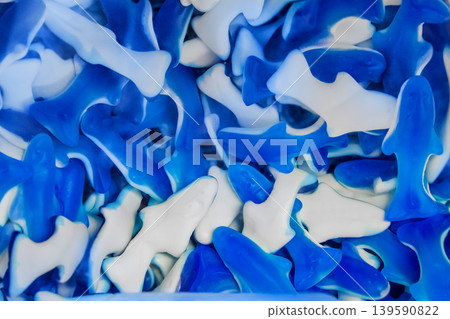 Gummies jelly sweet sugar marmalade white food object blue background candy gelatin Gummies jelly sweet sugar marmalade white food object blue background candy gelatin 139590822