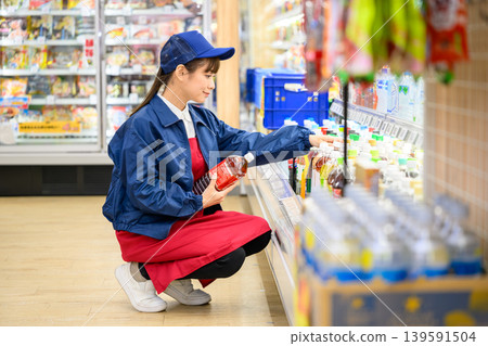 Female staff working at the supermarket Female staff working at the supermarket 139591504