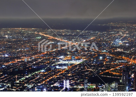 A breathtaking panoramic view of Bogotá, the capital of Colombia, at night, where roads of light intersect in the metropolis. A breathtaking panoramic view of Bogotá, the capital of Colombia, at night, where roads of light intersect in the metropolis. 139592197