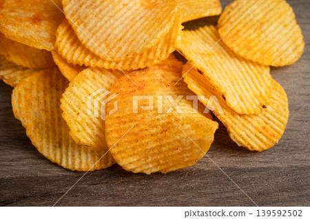 Potato chips , delicious BBQ seasoning spicy for crips, thin slice deep fried snack fast food. Potato chips , delicious BBQ seasoning spicy for crips, thin slice deep fried snack fast food. 139592502