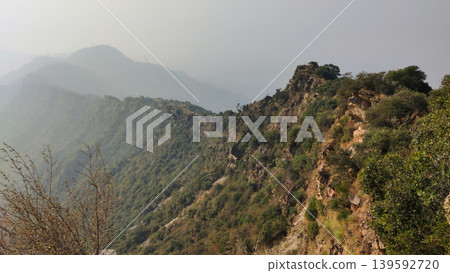 Mountain cliffs of Tilla Jogian covered with green forest landscape Mountain cliffs of Tilla Jogian covered with green forest landscape 139592720