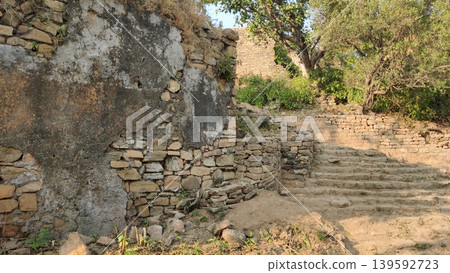 Ancient stone pathway leading through abandoned Tilla Jogian ruins Pakistan Ancient stone pathway leading through abandoned Tilla Jogian ruins Pakistan 139592723