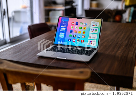 Laptop on dining table 139592871