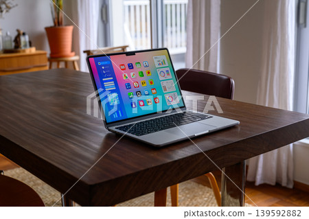 Laptop on a wooden table Laptop on a wooden table 139592882