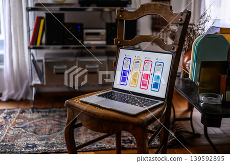 A laptop placed on a chair and the room A laptop placed on a chair and the room 139592895