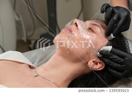 Facial Cleansing Procedure Close Up in Beauty Clinic Facial Cleansing Procedure Close Up in Beauty Clinic 139593023