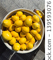 Fresh yellow lemons in a wicker basket, organic citrus harvested in the sun at an open market 139593076