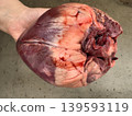 Close-up of raw animal heart in human hand, freshly cut offal meat for anatomical research, meat and food industry 139593119