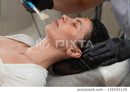 Cosmetologist Applying Facial Gel Before Peeling Procedure Close Up Cosmetologist Applying Facial Gel Before Peeling Procedure Close Up 139593139