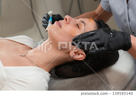 Cosmetologist Applying Facial Gel Before Peeling Procedure Close Up Cosmetologist Applying Facial Gel Before Peeling Procedure Close Up 139593140
