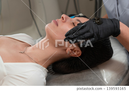 Cosmetologist Applying Facial Gel Before Peeling Procedure Close Up Cosmetologist Applying Facial Gel Before Peeling Procedure Close Up 139593165