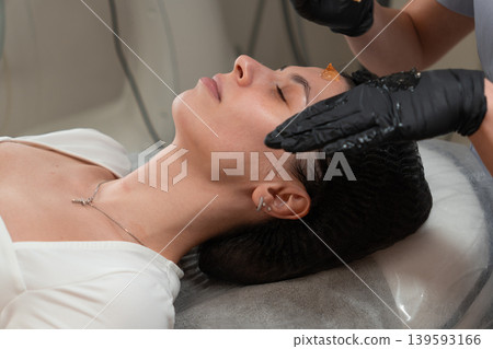 Cosmetologist Applying Facial Gel Before Peeling Procedure Close Up Cosmetologist Applying Facial Gel Before Peeling Procedure Close Up 139593166