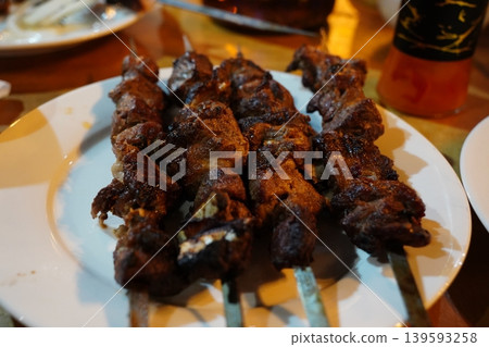 Grilled Lamb Shashlik Skewers on a White Plate Grilled Lamb Shashlik Skewers on a White Plate 139593258
