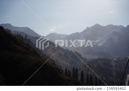 Breathtaking view of Shymbulak mountain peaks with snow in Almaty, Kazakhstan. Breathtaking view of Shymbulak mountain peaks with snow in Almaty, Kazakhstan. 139593402