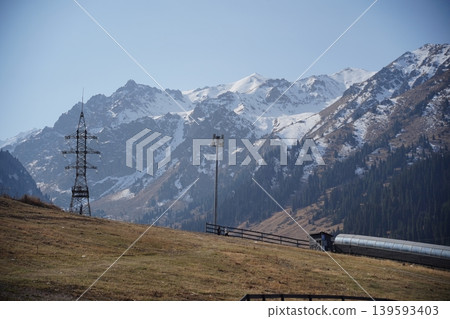 Breathtaking view of Shymbulak mountain peaks with snow in Almaty, Kazakhstan. Breathtaking view of Shymbulak mountain peaks with snow in Almaty, Kazakhstan. 139593403