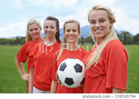 Woman, soccer players and portrait with ball, happy and football field for match, competition or game. Fitness, practice and ready for training, outdoor and exercise for athlete, confident or sport Woman, soccer players and portrait with ball, happy and football field for match, competition or game. Fitness, practice and ready for training, outdoor and exercise for athlete, confident or sport 139593794