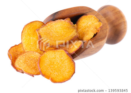 Crispy roasted sweet potato chips with sea salt, isolated on white background. Healthy and crunchy natural vegetable snack. Clipping path. 139593845