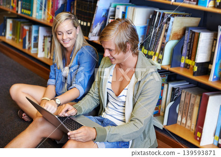 Teamwork, laptop or happy people studying in library at university, college or school campus for education. Bookshelf, elearning or students with scholarship, reading news, research or online course Teamwork, laptop or happy people studying in library at university, college or school campus for education. Bookshelf, elearning or students with scholarship, reading news, research or online course 139593871