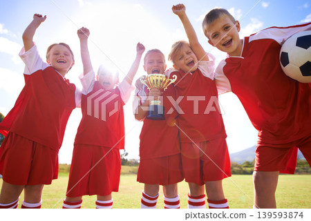 Celebration, soccer team and children with cup, young and smile with victory, support or proud. Achievement, sports and friendship, together and happy for win, ready for game or physical activity Celebration, soccer team and children with cup, young and smile with victory, support or proud. Achievement, sports and friendship, together and happy for win, ready for game or physical activity 139593874