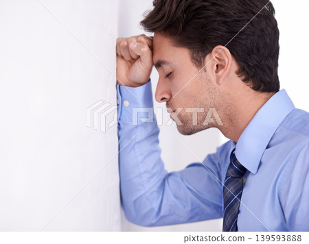 Stress, business man and head on wall for financial crisis, burnout and anxiety for challenge fail. Depression, frustrated and a tired professional in bankruptcy, debt and mistake in office mockup 139593888