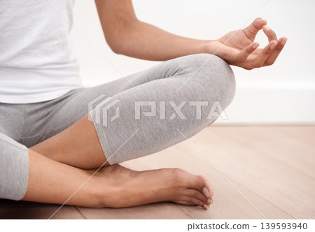 Person hands, meditation and spiritual in a home with mockup space and chakra for balance and mindfulness. Morning, wellness care and zen in house on floor to relax for calm and peace in lotus pose 139593940