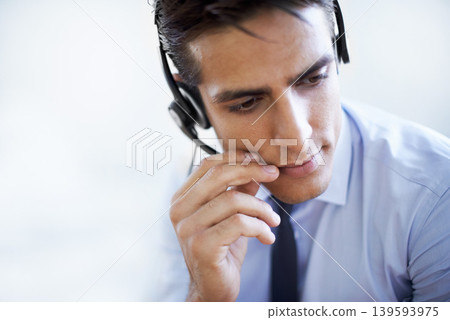 Call center, man and communication in studio of customer service, CRM questions and help on white background. Face, serious telemarketing agent and thinking of telecom advisory, microphone and mockup 139593975