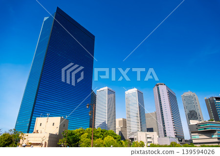 A beautiful view of the office district in Osaka Business Park (OBP) in Osaka Prefecture, with its clear blue sky and fresh greenery. A beautiful view of the office district in Osaka Business Park (OBP) in Osaka Prefecture, with its clear blue sky and fresh greenery. 139594026