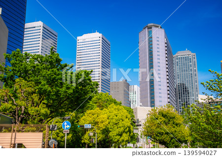 A beautiful view of the office district in Osaka Business Park (OBP) in Osaka Prefecture, with its clear blue sky and fresh greenery. A beautiful view of the office district in Osaka Business Park (OBP) in Osaka Prefecture, with its clear blue sky and fresh greenery. 139594027