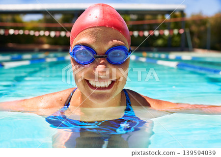 Sports, portrait or happy woman in swimming pool for competition training, workout or energy. Face, practice and cardio with female swimmer, goggles and athlete for exercise, wellness or fitness Sports, portrait or happy woman in swimming pool for competition training, workout or energy. Face, practice and cardio with female swimmer, goggles and athlete for exercise, wellness or fitness 139594039