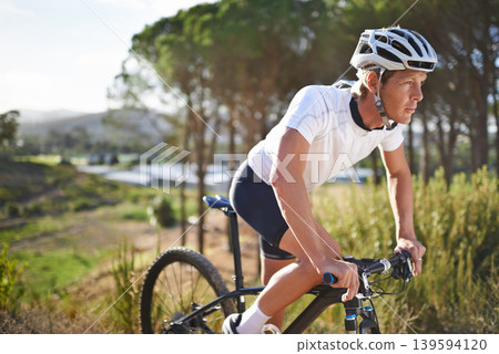 Man, mountain bike and cycling in forest for challenge or outdoor, exercise or athlete. Male person, transportation and off road hill terrain for countryside training or health, workout or adventure Man, mountain bike and cycling in forest for challenge or outdoor, exercise or athlete. Male person, transportation and off road hill terrain for countryside training or health, workout or adventure 139594120