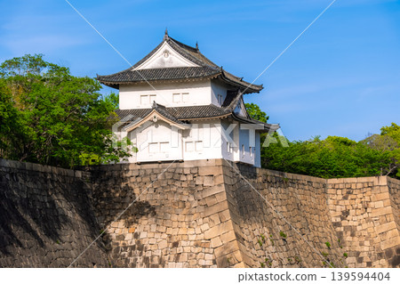 Osaka Castle's southern outer moat and the sixth turret, beautifully framed by the fresh greenery and blue sky, Osaka City, Osaka Prefecture. Osaka Castle's southern outer moat and the sixth turret, beautifully framed by the fresh greenery and blue sky, Osaka City, Osaka Prefecture. 139594404
