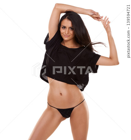 Woman, happy portrait and lingerie in studio with gesture and confident for fashion or gen z style. Arab, model and face expression for bare tummy or glow body and underwear by white background Woman, happy portrait and lingerie in studio with gesture and confident for fashion or gen z style. Arab, model and face expression for bare tummy or glow body and underwear by white background 139594721