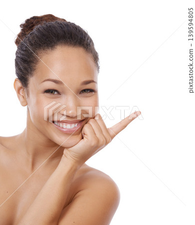 Woman, portrait and pointing at mockup for beauty, space and brand ambassador for skincare. Person, promotion and face in studio or marketing, direction and advertising offer on white background Woman, portrait and pointing at mockup for beauty, space and brand ambassador for skincare. Person, promotion and face in studio or marketing, direction and advertising offer on white background 139594805