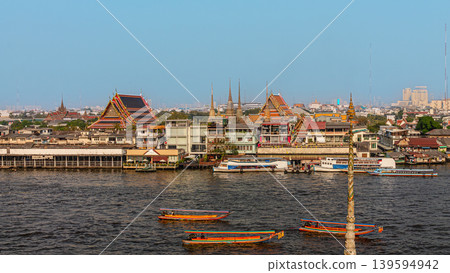 Cityscape view of riverside temples and boats during daytime in Bangkok, Thailand Cityscape view of riverside temples and boats during daytime in Bangkok, Thailand 139594942
