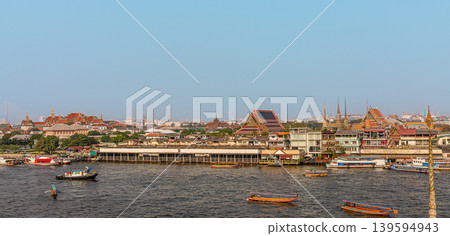 Cityscape view of riverside temples and boats during daytime in Bangkok, Thailand Cityscape view of riverside temples and boats during daytime in Bangkok, Thailand 139594943