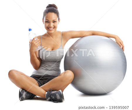 Happy woman, portrait and water by exercise ball for workout or training against a white studio background. Female person smile with bottle or natural mineral drink for fitness or hydration on mockup Happy woman, portrait and water by exercise ball for workout or training against a white studio background. Female person smile with bottle or natural mineral drink for fitness or hydration on mockup 139595007