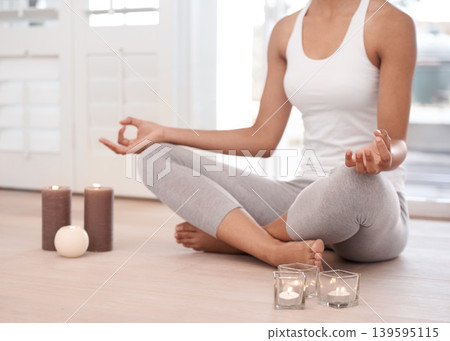 Woman, meditation and spiritual in a home with hands and chakra for balance and mindfulness. Morning, wellness and zen in house on floor to relax for calm breathing and peace in lotus position Woman, meditation and spiritual in a home with hands and chakra for balance and mindfulness. Morning, wellness and zen in house on floor to relax for calm breathing and peace in lotus position 139595115