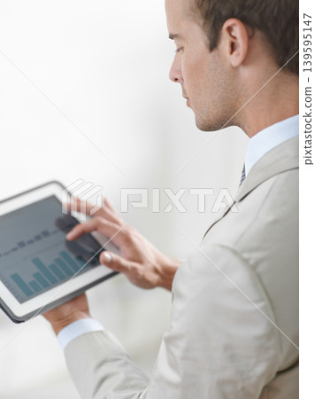 Business man, tablet screen and graphs, charts or data analysis for financial report, increase in revenue or profit. Professional trader or auditor with account management and digital statistics Business man, tablet screen and graphs, charts or data analysis for financial report, increase in revenue or profit. Professional trader or auditor with account management and digital statistics 139595147