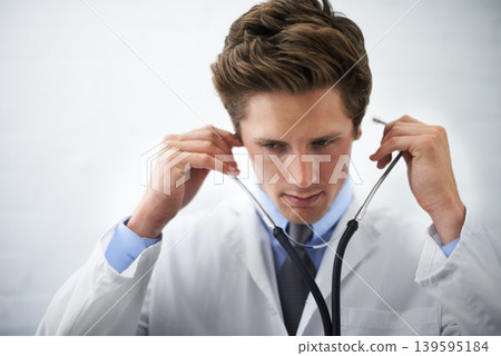 Serious, stethoscope and young doctor with medical career in cardiology at medicare hospital. Doubt, thinking and professional male healthcare worker, employee or intern with equipment in clinic. Serious, stethoscope and young doctor with medical career in cardiology at medicare hospital. Doubt, thinking and professional male healthcare worker, employee or intern with equipment in clinic. 139595184