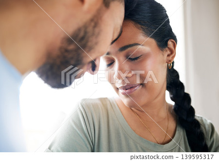 Couple, relax and smile in home with love connection, support and bonding together on weekend break. Happy, married people and peace in living room with relationship commitment, trust and loyalty. 139595317
