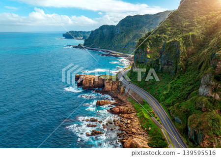 Aerial shot of Road near coast at Nanya rock in Taiwan. Aerial shot of Road near coast at Nanya rock in Taiwan. 139595516