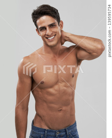 Man, portrait and happy or shirtless bodybuilder in studio, smile and fitness by gray background. Male person, abs and strong core or muscular abdomen, confident and results or progress from exercise Man, portrait and happy or shirtless bodybuilder in studio, smile and fitness by gray background. Male person, abs and strong core or muscular abdomen, confident and results or progress from exercise 139595734