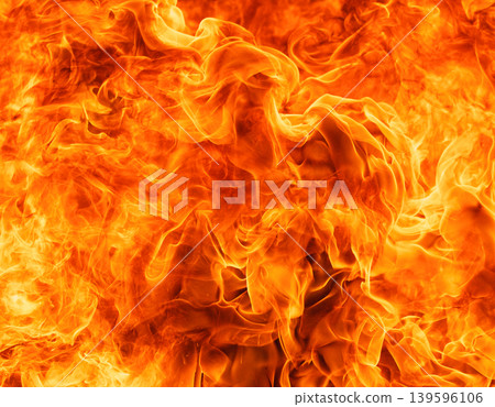Intense orange and yellow flames dance and swirl in a close up abstract view Intense orange and yellow flames dance and swirl in a close up abstract view 139596106